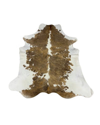 Geflecktes weiß-hellbraunes Kuhfell kaufen bei SWISSskulls – hochwertige Kuhfelle in Premiumqualität, natürlich gegerbt, einzigartig im Muster und perfekt für stilvolle Wohnräume.
